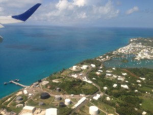 Bermuda from above: the island's northern tip, with outlying patch reefs (the dark spots) visible under the water.