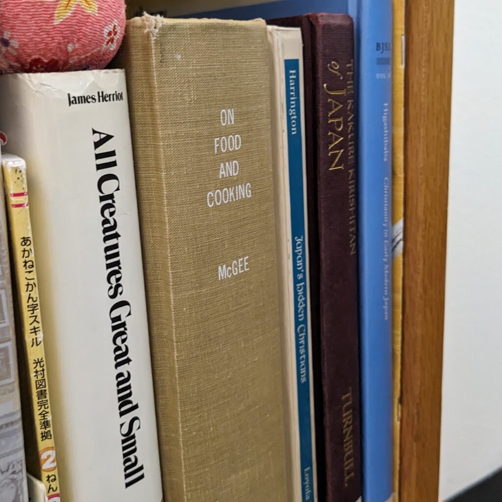 A few books on a bookshelf.