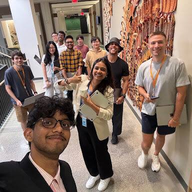 Kyaw (pink shirt) with his co-workers at Amazon